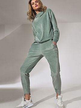 Tracksuit trousers Figl  Mint velour sweatpants with pockets. A drawstring waist without binding. Legs tapered at the bottom, finished with an asymmetrical welt.