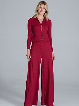 Trousers Figl  Bell-bottomed trousers of flowing, ribbed knit, with a wide rubber band at the waist, without pockets.