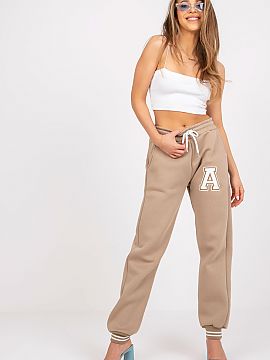 Tracksuit trousers Ex Moda  Women\'s sweatpants with elastic band and binding at the waist. Slip-on pockets on the sides.