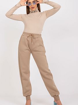 Tracksuit trousers Ex Moda  Women\'s sweatpants with elastic band and binding at the waist. Slip-on pockets on the sides.