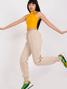 Tracksuit trousers Ex Moda  Women\'s sweatpants with elastic band and binding at the waist. Slip-on pockets on the sides.