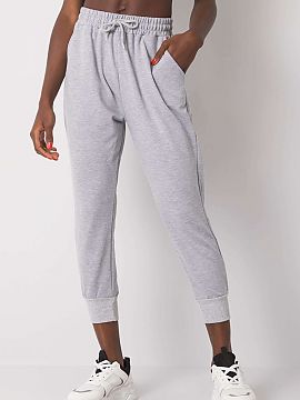 Tracksuit trousers Fancy  Sweatpants with elastic band and waist tie. Slip-on pockets on the sides, leg ends with welts.