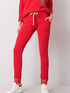 Tracksuit trousers Relevance  High rise sweatpants with a tie at the waist. Slip-on pockets on the sides. Decorated with rhinestones at the cuffs.