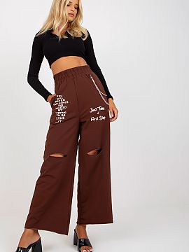 Women trousers Fancy  Sweatpants with wide legs, slip pockets on the sides, elastic waistband, decorative slits and lettering on the front. Comes with a detachabl