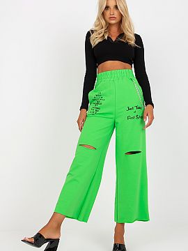 Women trousers Fancy  Sweatpants with wide legs, slip pockets on the sides, elastic waistband, decorative slits and lettering on the front. Comes with a detachabl