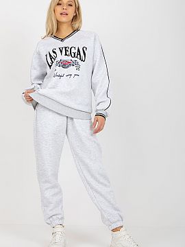 Set Ex Moda  A sweatshirt set consisting of a sweatshirt and pants. Sweatshirt with long sleeves and a heart neckline. Long pants with waist tie and slip