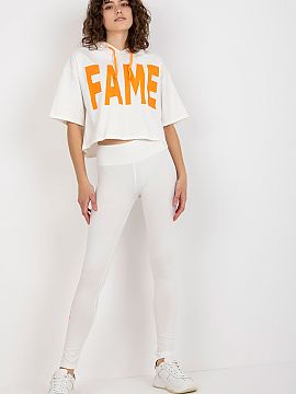 Set Ex Moda  A sweatshirt set consisting of a sweatshirt and leggings. Sweatshirt of a loose cut with short sleeves and a hood. Long leggings with wide e