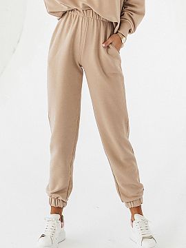 Tracksuit trousers IVON  Sweatpants joggers sewn from soft cotton. Comfortable legs finished with a drawstring, elastic waistband, and pockets on the sides, we guara