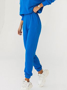 Tracksuit trousers IVON  Sweatpants joggers sewn from soft cotton. Comfortable legs finished with a drawstring, elastic waistband, and pockets on the sides, we guara