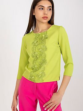 Blouse Lakerta  Blouse with 3/4 sleeves and a round neckline. Decorative lace sewn on the front.