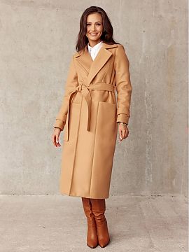Coat Roco Fashion  The model is tied at the waist, has pockets in the front and a slit in the back. Tiered coat will be a perfect choice for any outfit and for