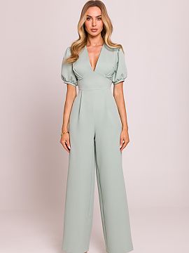Suit Moe  Stylish jumpsuit with a feminine cut, made of high-quality fabric. The deep V-neck beautifully accentuates the neck and décolletage, while 