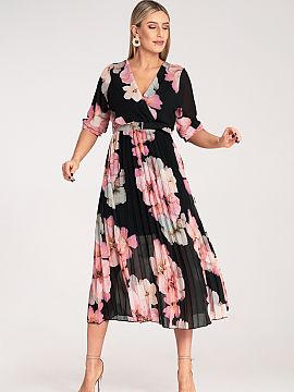 Daydress Figl  Midi dress with a striking floral print and pleats. The model has a wrap neckline, elastic waistband, and a belt accentuating the waist. 3/4