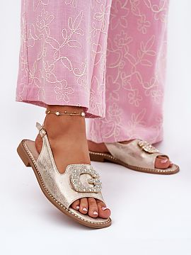 Sandals Step in style  Women\'s sandals made of eco leather are a stylish proposal for hot days. Set on a flat heel, they guarantee comfort and stability throughou