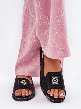 Sandals Step in style  Women\'s sandals made of eco leather are an elegant proposition for summer days. Set on a flat heel, they provide comfort and stability thro