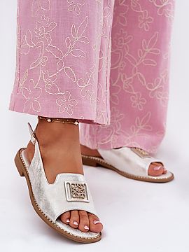 Sandals Step in style  Women\'s sandals made of eco leather are an elegant proposal for summer days. Set on a flat heel, they provide comfort and stability through