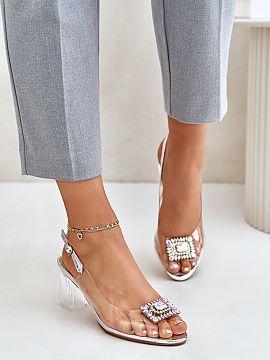 Heel sandals Step in style  Women\'s sandals with a transparent upper. Set on a column-shaped heel. At the front, there is a brooch that adds elegance. The soft insole 