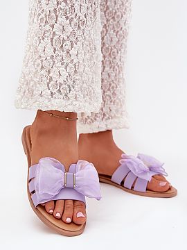 Flip-flops Step in style  Women\'s eco-leather sandals, set on a flat heel, are a perfect proposition for everyday wear. They stand out with a tulle bow. Perfect for 