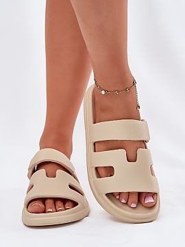 Flip-flops Step in style  Women\'s foam clogs are a lightweight and comfortable option for warm days. This model stands out with cuts on the strap and imitation of a 