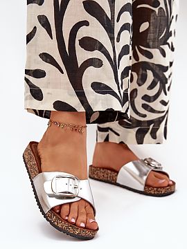 Flip-flops Step in style  Women\'s eco-leather sandals, set on a cork platform, are a combination of style and comfort. The profiled eco-suede insole ensures comfort 