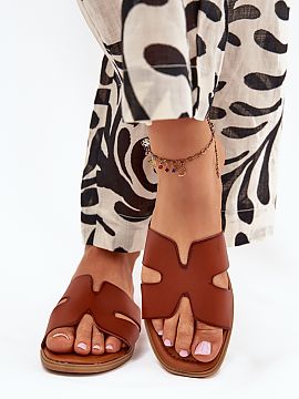 Flip-flops Step in style  Women\'s sandals made of eco leather, set on a flat heel, are a combination of simplicity and elegance. The strap with cutouts adds a subtle