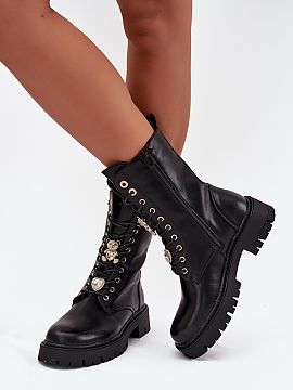 Bootie Step in style  Ladies\' ankle boots made of eco leather are a combination of style and comfort for cooler days. A lace-up model with an additional zipper, 