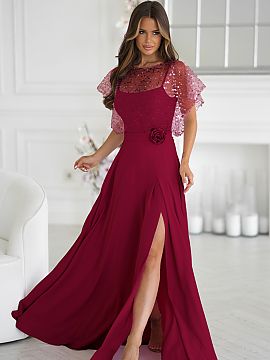 Long dress Bicotone  An elegant dress with thin straps, made of lightweight material, complemented by a shiny sequin bolero with a rose on the belt. The shiny fi