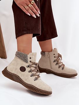 Trapper shoes Step in style  Women\'s ankle boots made of eco leather. The model has a zipper and lacing, which ensures comfort of use and the possibility of perfect fit