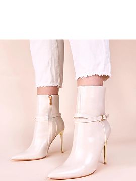 Heeled boots Solea  We present unique beige ankle boots on a shiny gold stiletto from Carmila, which are the quintessence of elegance and style. These versatile