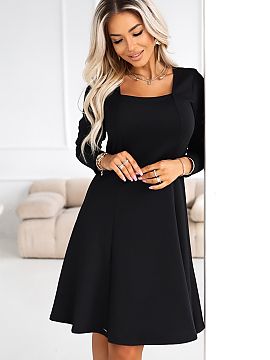 Daydress Numoco  Discover a dress that is the definition of contemporary elegance. This black midi dress from the Numoco brand is a modern interpretation of 