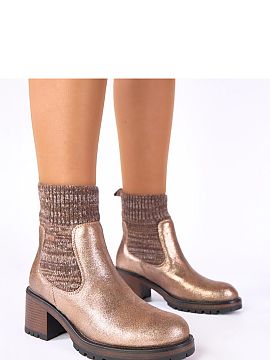Heel boots Solea  Golden ankle boots with a sock-like shaft from the Gemre brand are a combination of the latest trends with everyday comfort. This model was 