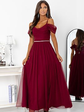 Long gown With You  The burgundy evening dress with a slit and open shoulders is the epitome of elegance and femininity. Made of light, airy material, it beauti