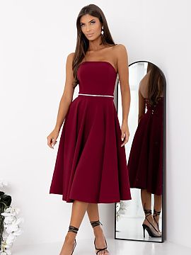 Evening dress With You  An elegant strapless dress is a proposal that combines a classic form with eye-catching details. The model is fastened with a concealed zipp