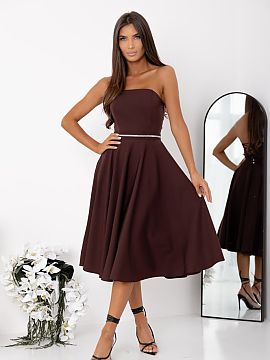 Evening dress With You  An elegant strapless dress is a proposal that combines classic form with eye-catching details. The model is fastened with a concealed zipper