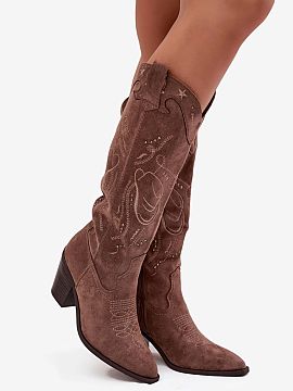 Heeled boots Step in style  Women\'s cowboy-style boots made of eco suede are a proposal that combines classic with a fashionable, distinctive character. Set on a stabl