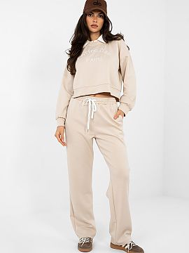 Complete Italy Moda  A tracksuit set consisting of a hoodie and pants is a comfortable proposition for everyday styling in a casual style. Shorter than a standar