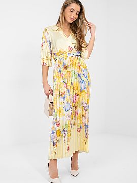 Daydress Italy Moda  A summer maxi dress with a flared cut is a combination of lightness, elegance, and feminine style. The model dazzles with a floral pattern t