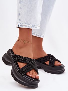 Slippers Step in style  Women\'s sandals on a massive platform are a fashionable and comfortable option for summer days. The front is decorated with two interwoven 
