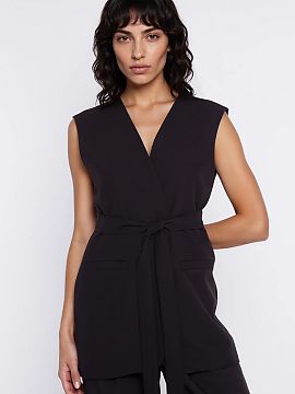 Vest Nife  Stylish women\'s vest with a regular fit is an elegant and modern wardrobe piece that works great in both casual and more formal outfits. Th