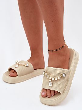 Platform sandals Step in style  Women\'s flip-flops made of foam material are a lightweight and comfortable option for warm days. The model placed on a delicate platform en