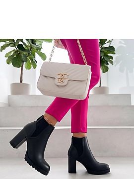 Heel boots Solea  Women\'s boots with a trapper sole are a stylish combination of classic form with striking, trendy details. Made of eco-leather, they stand 