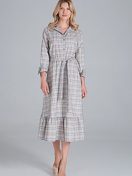 Daydress Figl  Maxi dress cut off at waist with elastic band. The bottom of the dress is flared with a ruffle, V neckline with lapels, buttoned halfway. Sl