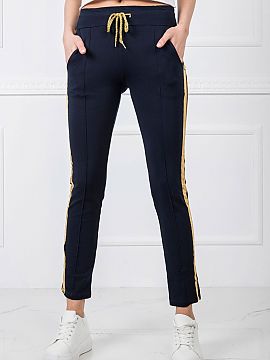 Tracksuit trousers BFG  Women\'s sweatpants with an elastic waistband and binding. Pants with decorative contrasting stripes on the sides and slip pockets.