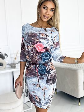 Daydress Numoco  Sporty dress with binding, 3/4 sleeves and pockets, flowers on a stone background. Made of stretchy material with a slightly suede texture. 
