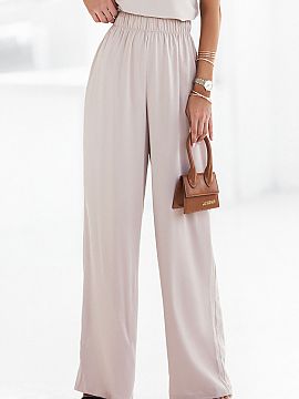 Trousers IVON  Loose pants sewn from elegant premium fabric. High rise with comfortable elastic waistband, two handy pockets and wide legs, will provide yo