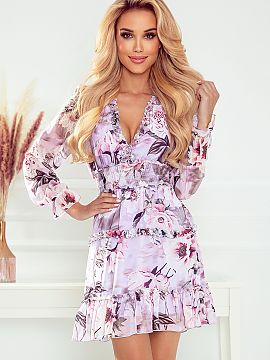 Daydress Numoco  Chiffon dress with elastic waistband and frills. Delicate frills all over the dress add charm. Wild rose pattern. Made of pleasant to the to