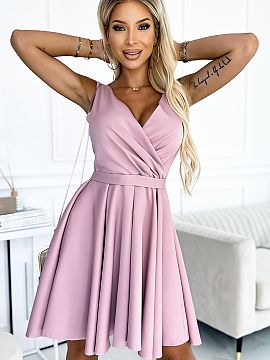 Cocktail dress Numoco  Asymmetrical dress with a longer back, neckline and belt. Dress made of fabric in the color of dirty pink. The skirt with a longer back will