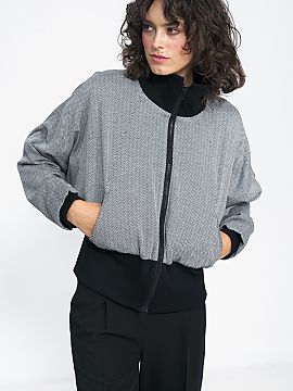 Jacket Nife  The black herringbone jacket has a short, straight cut that looks great with high-waisted pants and skirts. The minimalist cut works well in